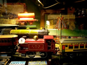 There are hundreds of model trains, cars, trucks from various decades
